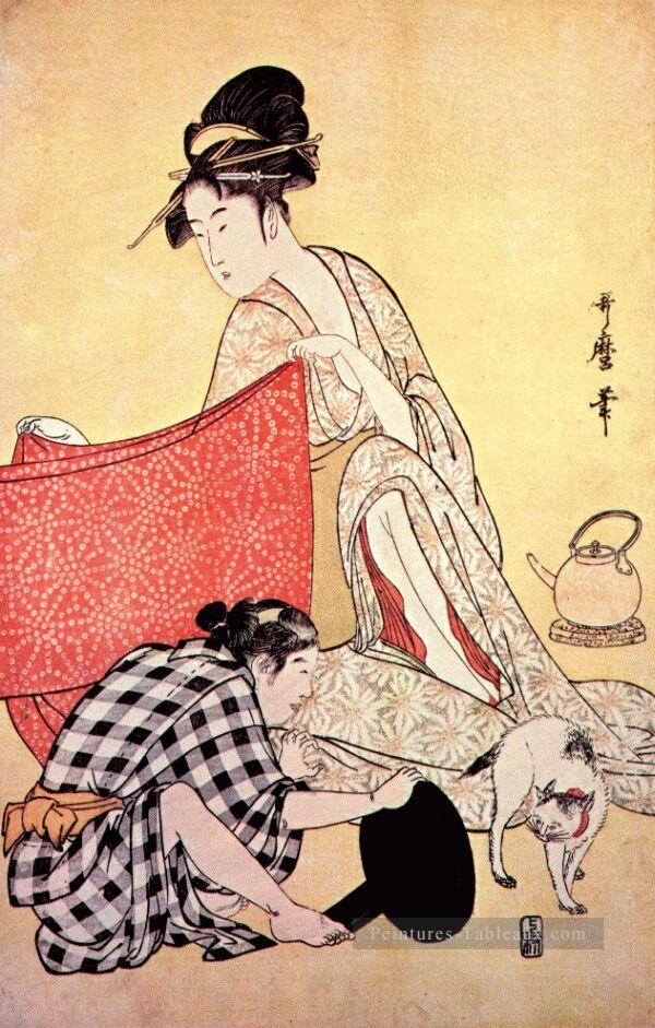 femmes faisant des robes 2 Kitagawa Utamaro ukiyo e Bijin GA Peintures à l'huile